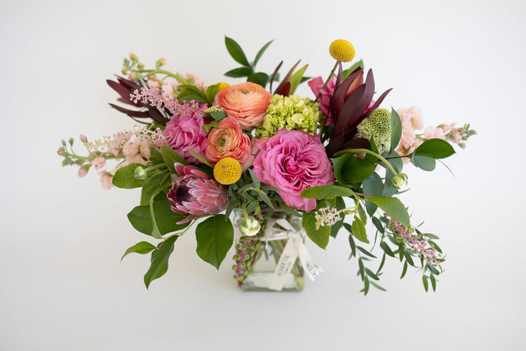 "Stunning pink floral arrangement crafted by NovaPetal Flower Lab, featuring vibrant hues and intricate design to capture the essence of beauty and brightness. offering same day delivery in phoenix.