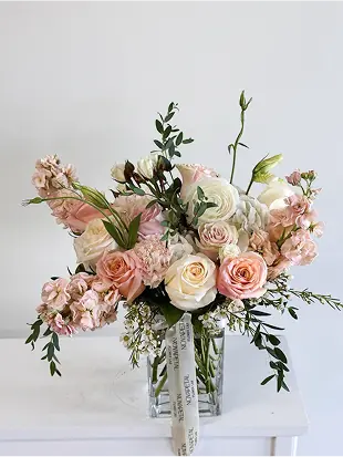Bouquet with pastel pink and white flowers in a vase