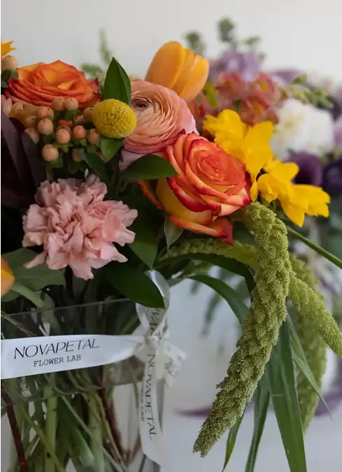 A bright bouquet with orange and yellow flowers